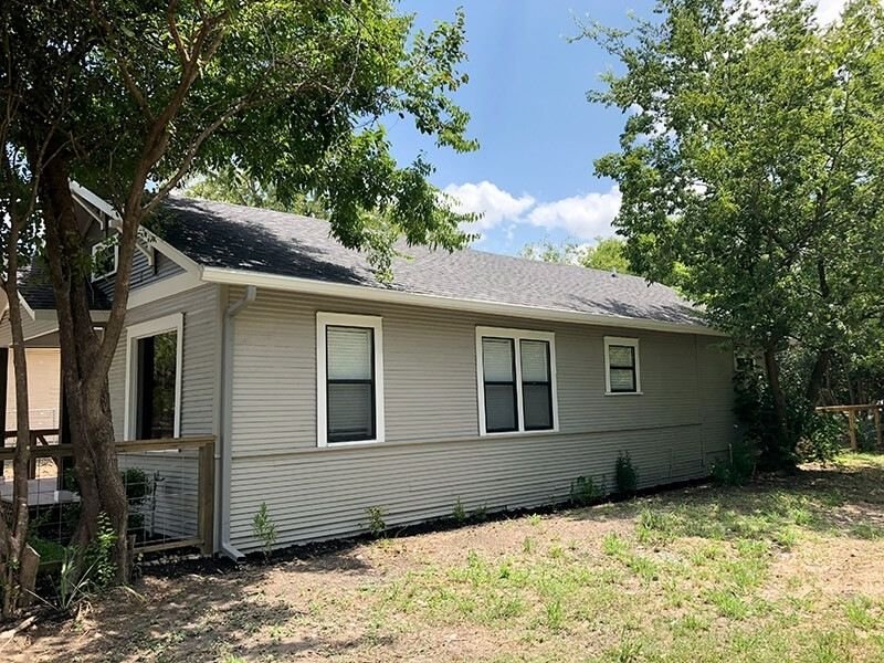gray single story after renovatio side view