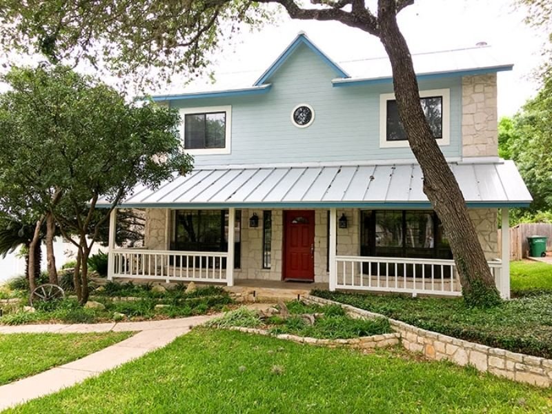 house painted blue with front porch