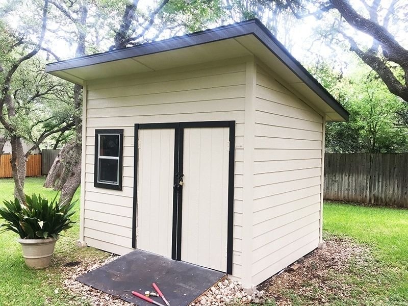 shed painted tan with black accents