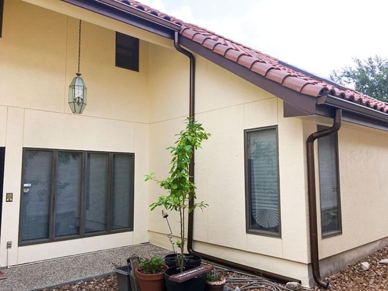 spanish style house painted yellow