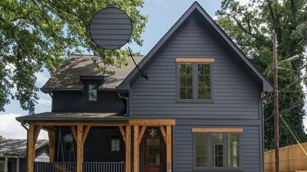 Charcoal gray vinyl siding with natural wood accents and modern landscaping