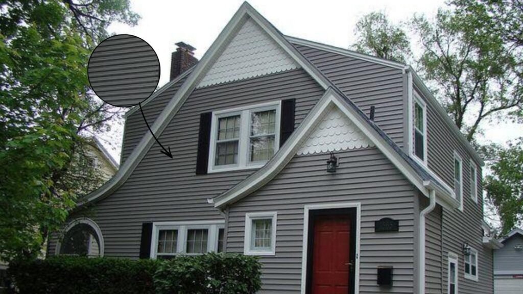 Modern home with warm greige vinyl siding and white trim exterior design