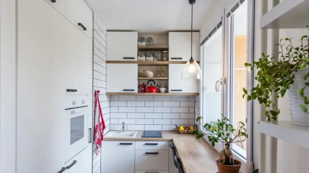 mall white kitchen with wood shelves and window seating.