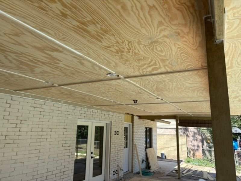 Plywood ceiling installed on covered patio
