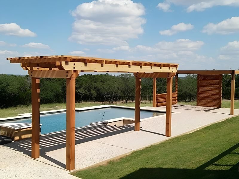 Wooden pergola beside swimming pool